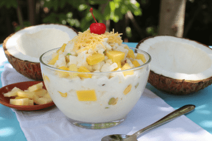 Chilled coconut milk fruit salad with nata de coco, pineapple, kaong, and shredded cheese served in a glass bowl – buko salad recipe by readyprepmeals