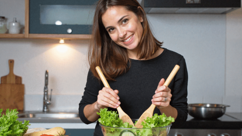 Sam mixing a healthy salad ready for lunch in her favorite part of her home - the kitchen.