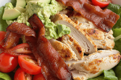 Keto BLT chicken salad with crispy bacon, grilled chicken, avocado, mashed avocado dressing, and cherry tomatoes