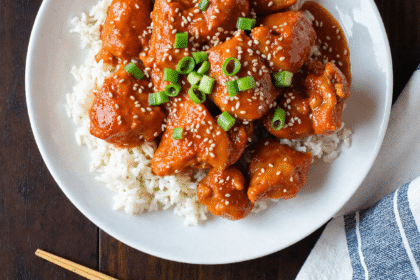 Sweet chili chicken served over steamed white rice with broccoli and sesame seeds