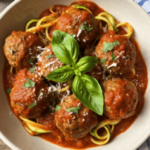 High-protein turkey meatball marinara with tomato sauce, basil, and parmesan over pasta